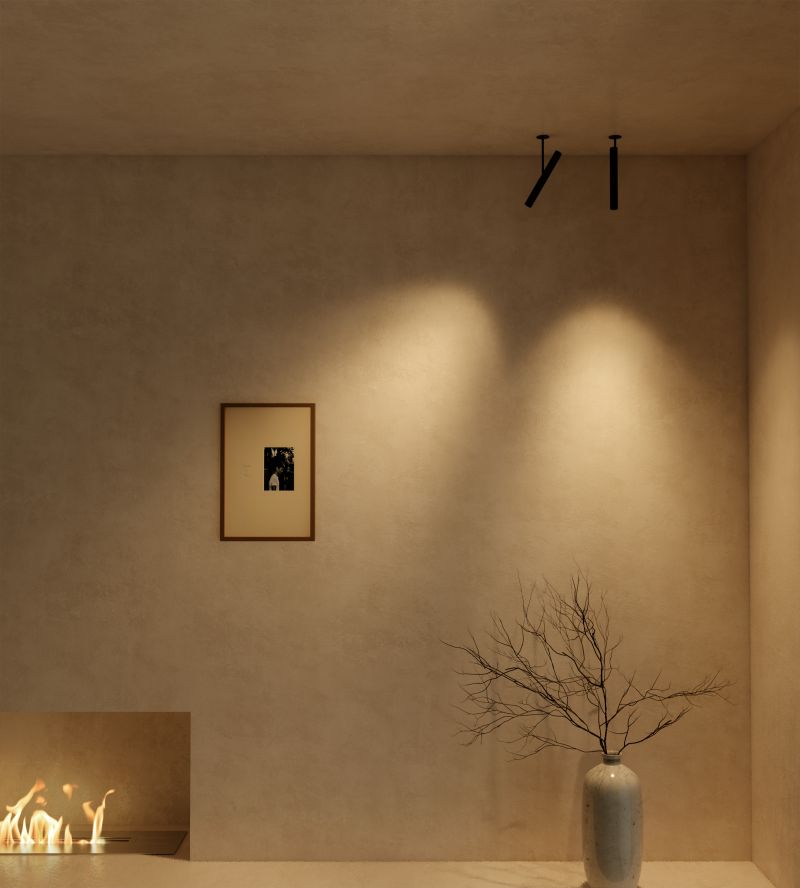 Mur mis en valeur par deux spots orientables sur plafond